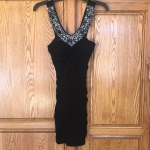 Juniors black stretchable dress with thick gemmed/rock straps. Size small